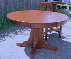 Stickley Brothers 48 in dining table with three leaves.  Signed.  Professionally refinished.